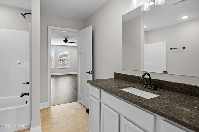 full bathroom with vanity, recessed lighting, shower / bath combination, baseboards, and visible vents