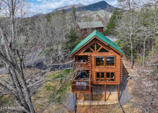 exterior space featuring a mountain view