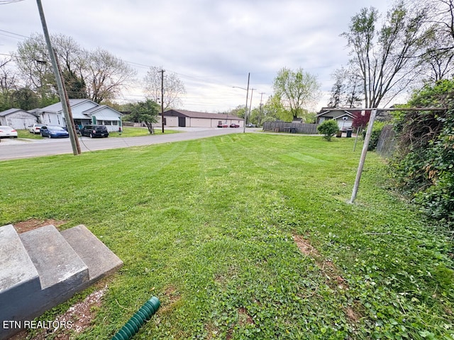 view of yard featuring a residential view