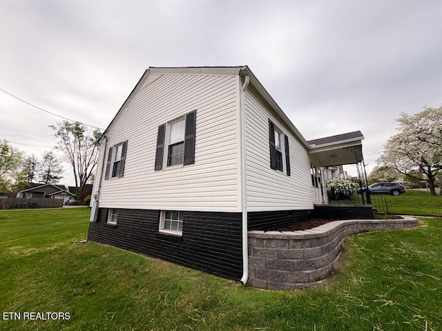 view of home's exterior featuring a yard