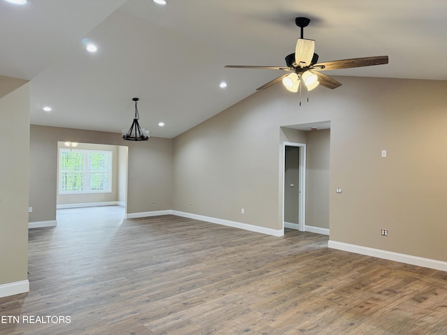 710 Westchester Dr, Crossville, TN 38558 - empty room with wood finished floors, baseboards, ceiling fan, recessed lighting, and vaulted ceiling