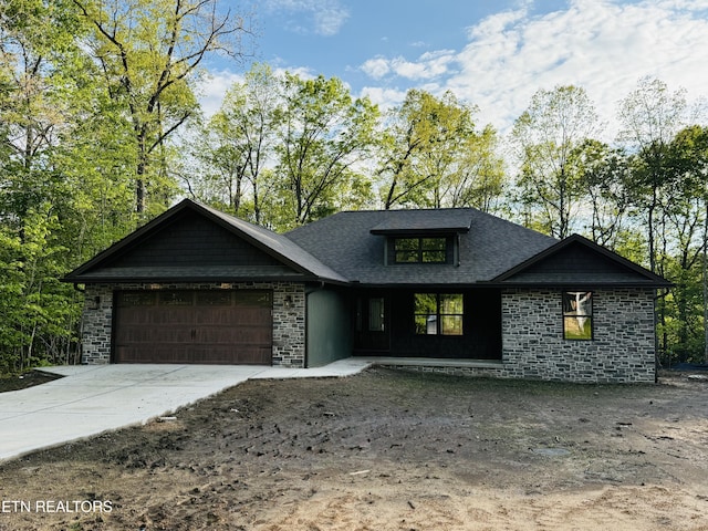 710 Westchester Dr, Crossville, TN 38558 - view of front of property with an attached garage, stone siding, concrete driveway, and a shingled roof