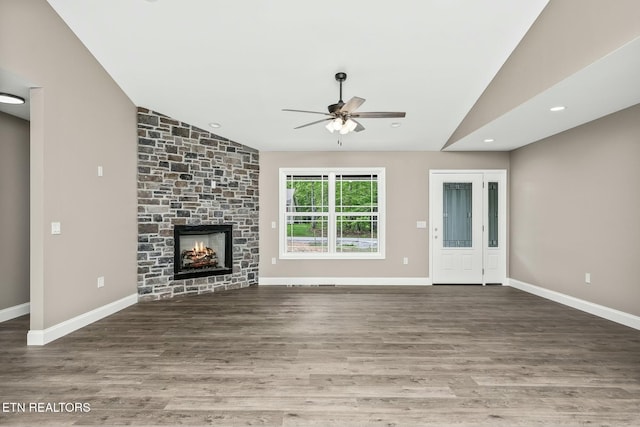 710 Westchester Dr, Crossville, TN 38558 - unfurnished living room featuring vaulted ceiling, a ceiling fan, wood finished floors, a fireplace, and baseboards