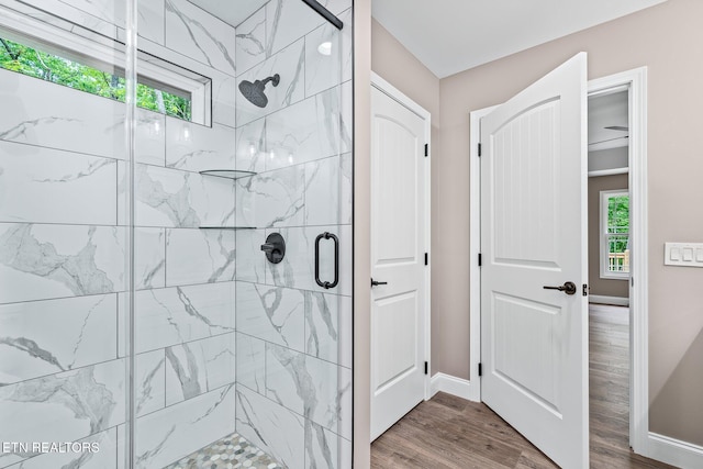 710 Westchester Dr, Crossville, TN 38558 - bathroom with a shower stall, wood finished floors, and baseboards