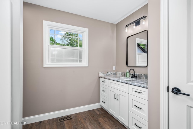 710 Westchester Dr, Crossville, TN 38558 - bathroom with baseboards, vanity, and wood finished floors