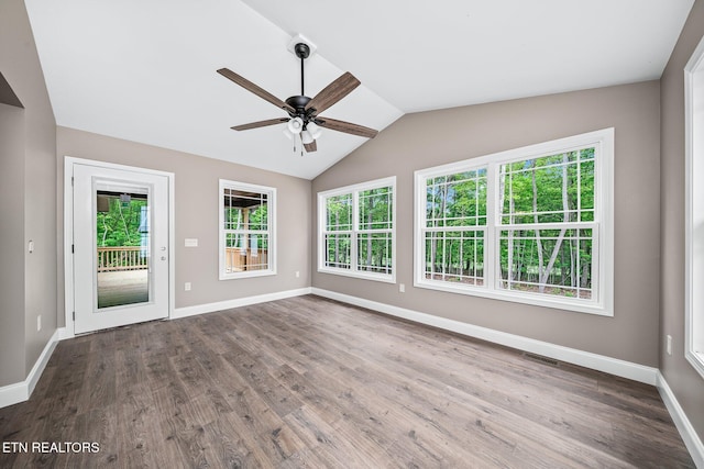 710 Westchester Dr, Crossville, TN 38558 - empty room featuring a ceiling fan, wood finished floors, baseboards, and vaulted ceiling