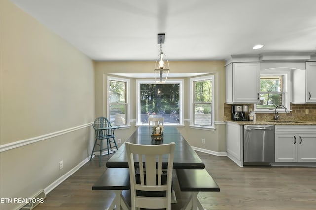 1517 Deerfield Way, Lafollette, TN 37766 - dining space with wood finished floors, baseboards, and arched walkways