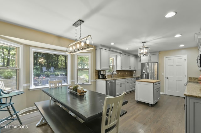 1517 Deerfield Way, Lafollette, TN 37766 - dining space featuring baseboards, a wealth of natural light, a chandelier, and dark wood finished floors