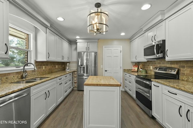 1517 Deerfield Way, Lafollette, TN 37766 - kitchen with a sink, decorative backsplash, butcher block countertops, appliances with stainless steel finishes, and dark wood-style flooring