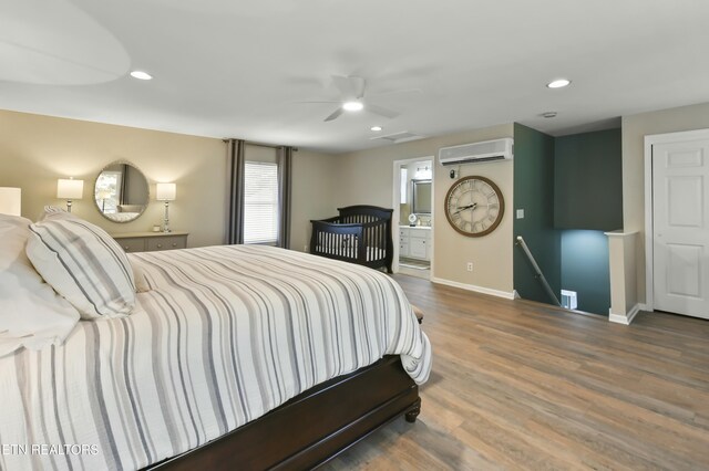 1517 Deerfield Way, Lafollette, TN 37766 - bedroom with a wall mounted air conditioner, baseboards, wood finished floors, and recessed lighting