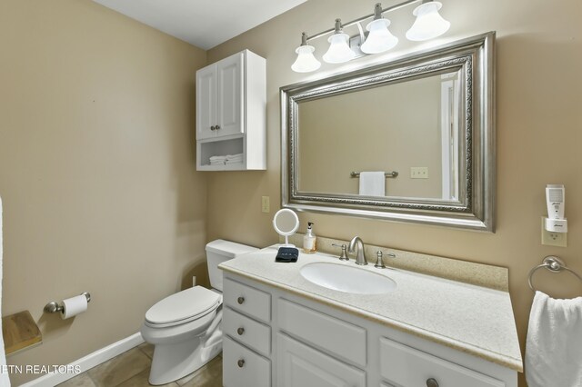 1517 Deerfield Way, Lafollette, TN 37766 - bathroom with baseboards, vanity, tile patterned flooring, and toilet