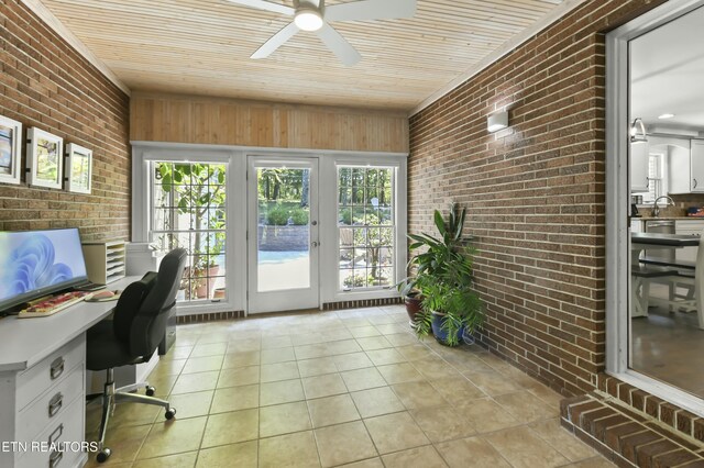 1517 Deerfield Way, Lafollette, TN 37766 - home office with a ceiling fan, brick wall, and light tile patterned floors