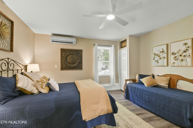 1517 Deerfield Way, Lafollette, TN 37766 - bedroom with a wall mounted air conditioner, ceiling fan, and wood finished floors