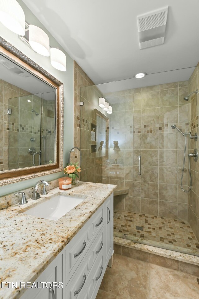 1517 Deerfield Way, Lafollette, TN 37766 - bathroom with a shower stall, visible vents, tile patterned flooring, and vanity