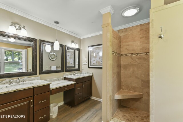 1517 Deerfield Way, Lafollette, TN 37766 - bathroom with a tile shower, double vanity, wood finished floors, a sink, and crown molding