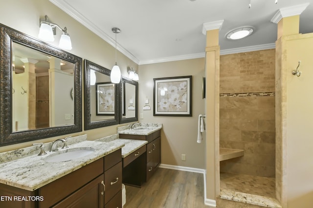 1517 Deerfield Way, Lafollette, TN 37766 - full bathroom featuring decorative columns, wood finished floors, a tile shower, and a sink