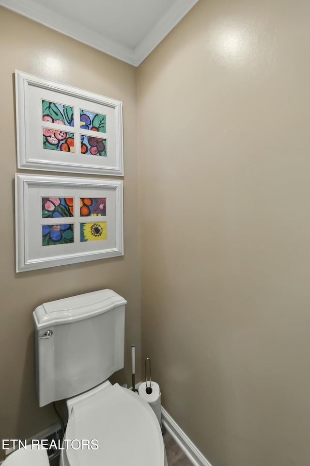 1517 Deerfield Way, Lafollette, TN 37766 - bathroom with toilet, crown molding, wood finished floors, and baseboards