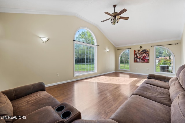 living room featuring plenty of natural light, vaulted ceiling, wood finished floors, and a ceiling fan