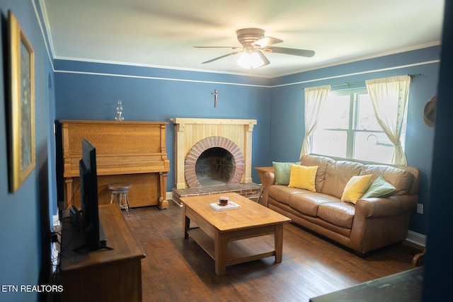 living room featuring ornamental molding, a ceiling fan, and wood finished floors
