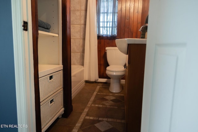bathroom with vanity, toilet, and tile patterned floors