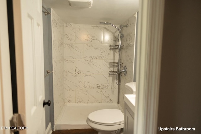 full bath featuring vanity, a stall shower, and toilet