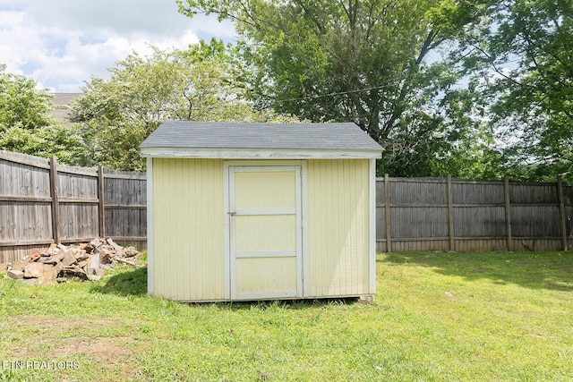 view of shed with a fenced backyard