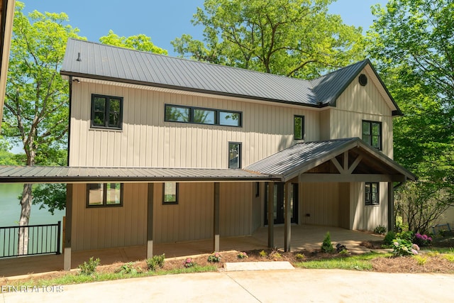 modern inspired farmhouse featuring metal roof