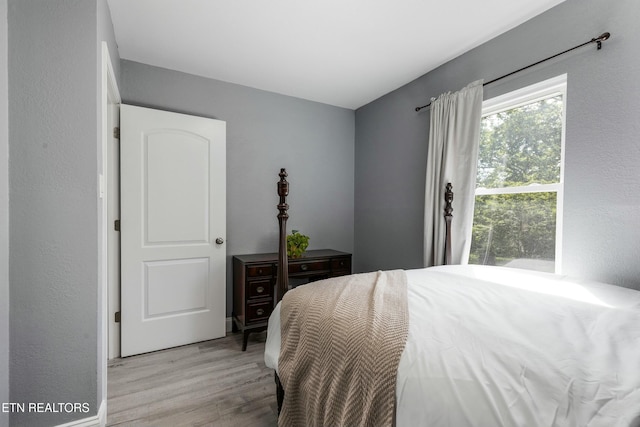 bedroom with light wood finished floors
