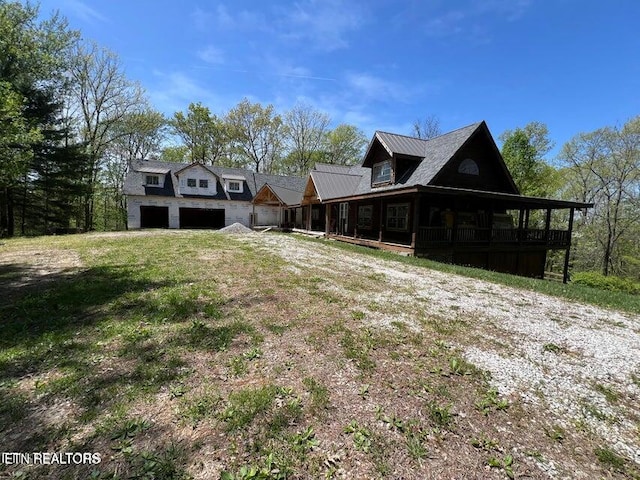 exterior space featuring an attached garage and a porch