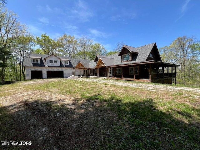view of front of house with an attached garage and covered porch