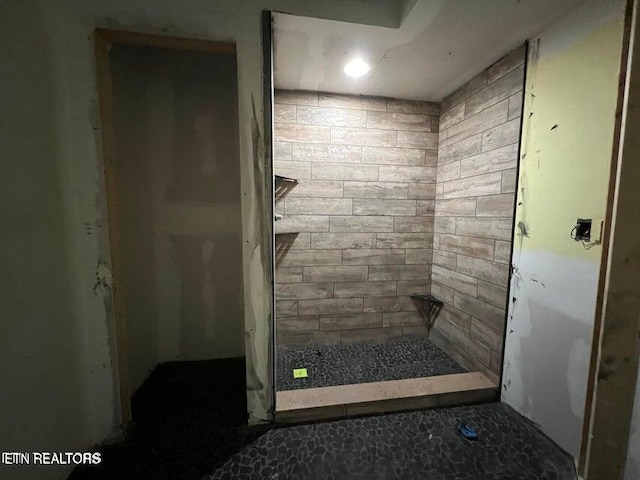 full bath featuring a shower stall