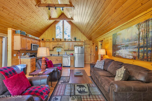 721 Poplar Falls Way, Gatlinburg, TN 37738 - living area featuring wood walls, lofted ceiling, light wood-style floors, wood ceiling, and rail lighting