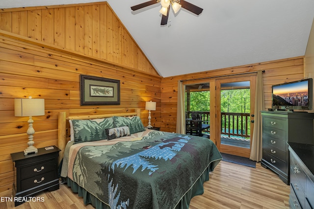 721 Poplar Falls Way, Gatlinburg, TN 37738 - bedroom featuring wood walls, ceiling fan, access to outside, light wood-style flooring, and vaulted ceiling