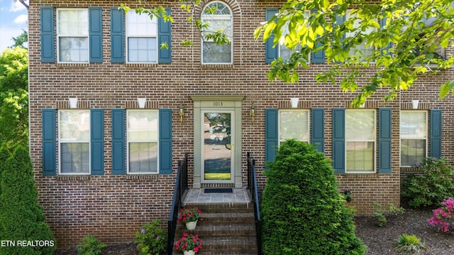 view of front of home featuring brick siding