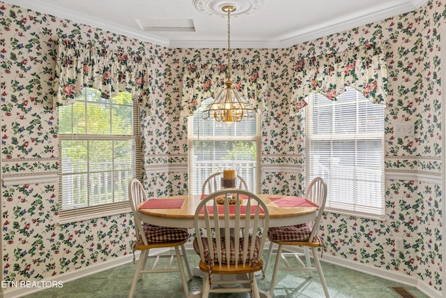 dining room featuring wallpapered walls and ornamental molding