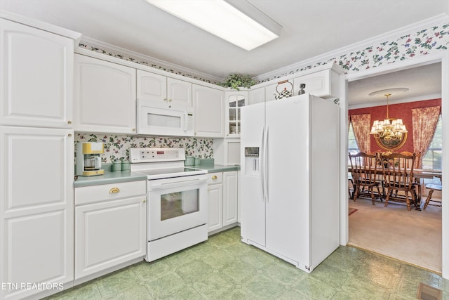 kitchen with a notable chandelier, white appliances, white cabinetry, light floors, and glass insert cabinets