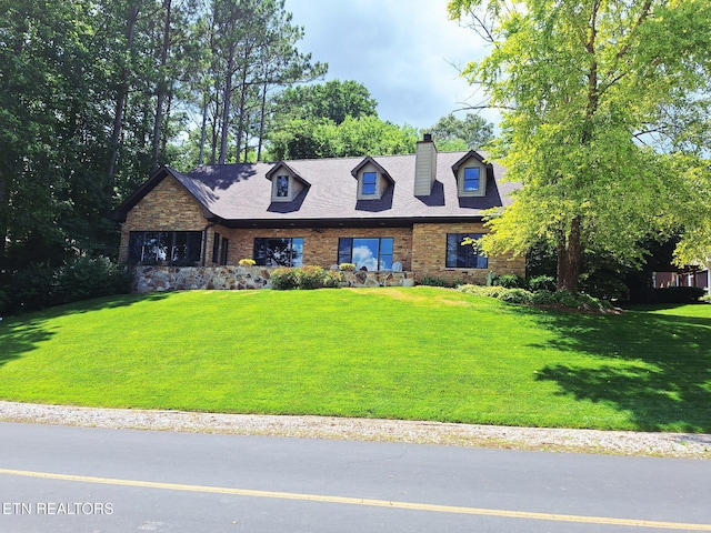 215 Dudala Way, Loudon, TN 37774 - cape cod-style house with a chimney, a front lawn, and brick siding