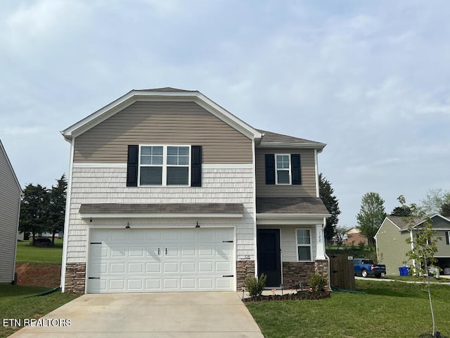 128 Waverly, Talbott, TN 37877 - view of front of house with an attached garage, driveway, stone siding, and a front yard