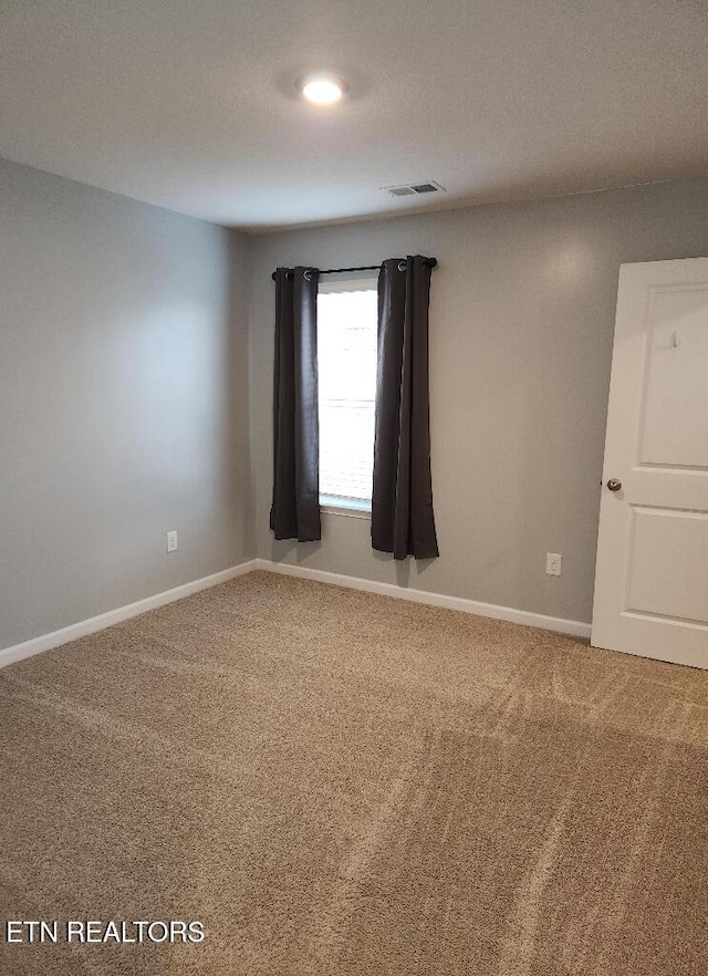 128 Waverly, Talbott, TN 37877 - carpeted empty room with baseboards and visible vents