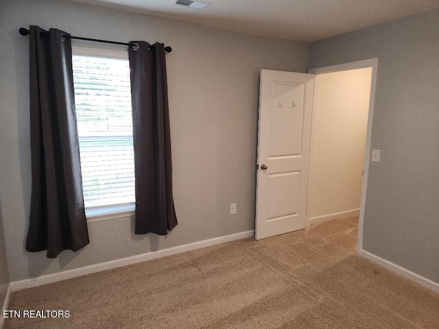 128 Waverly, Talbott, TN 37877 - carpeted spare room with visible vents and baseboards