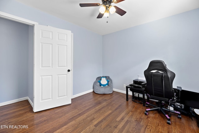 office featuring wood finished floors, a ceiling fan, and baseboards