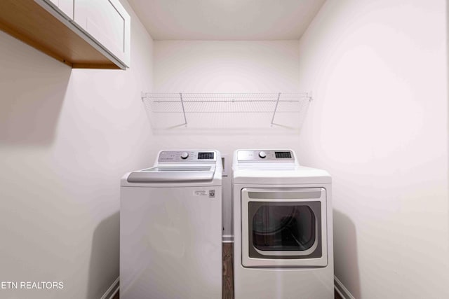 washroom featuring laundry area and separate washer and dryer