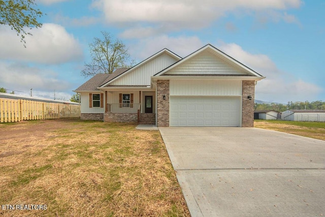 view of front of house with fence, concrete driveway, a porch, a front yard, and a garage