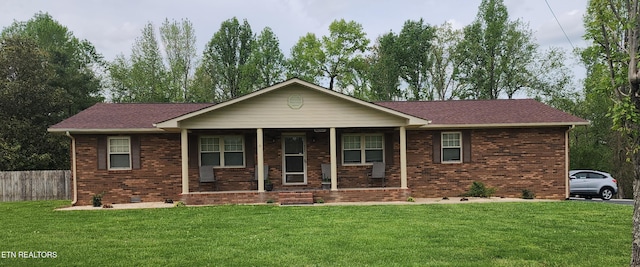 1058 Mountain View Rd, Robbins, TN 37852 - view of front facade featuring covered porch, brick siding, and roof with shingles