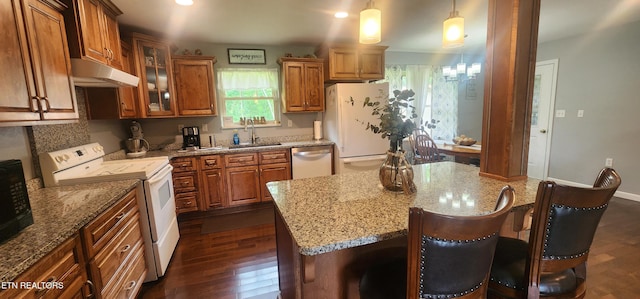 1058 Mountain View Rd, Robbins, TN 37852 - kitchen with white appliances, under cabinet range hood, brown cabinets, light stone countertops, and glass insert cabinets