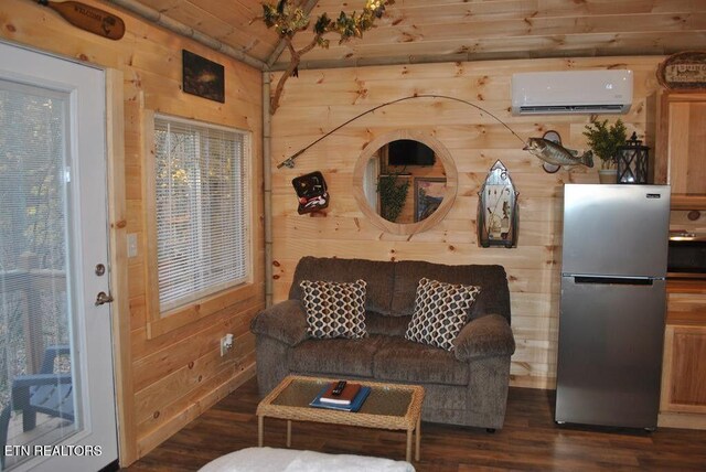 750 Caney Creek Rd, Cosby, TN 37722 - living room featuring dark wood-type flooring, wooden walls, and an AC wall unit