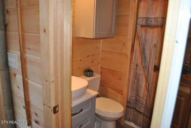 750 Caney Creek Rd, Cosby, TN 37722 - half bath with wood walls, vanity, and toilet