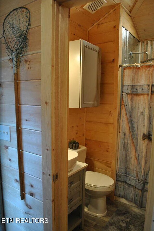 750 Caney Creek Rd, Cosby, TN 37722 - bathroom with toilet, wood walls, lofted ceiling, and visible vents