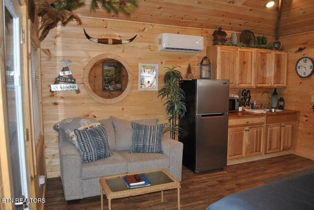 750 Caney Creek Rd, Cosby, TN 37722 - living room featuring dark wood finished floors, wooden walls, lofted ceiling, and a wall unit AC