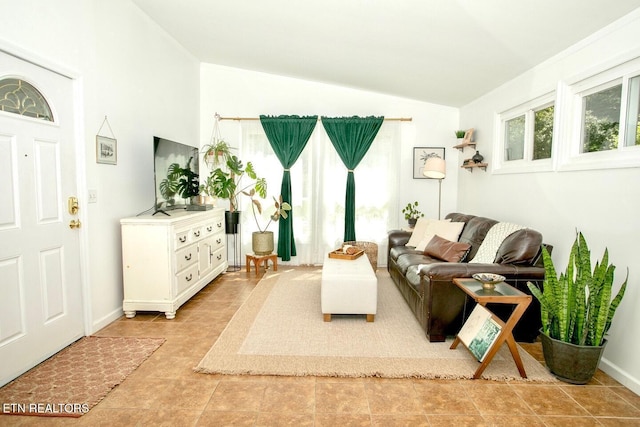1340 Sumac Dr, Knoxville, TN 37919 - living room featuring lofted ceiling and baseboards